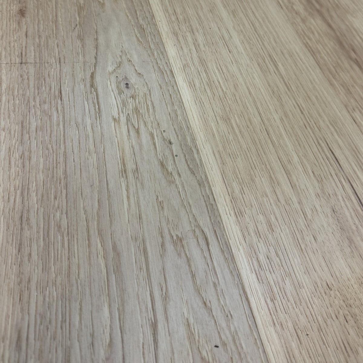 Close-up of natural hickory planks showing the brushed grain